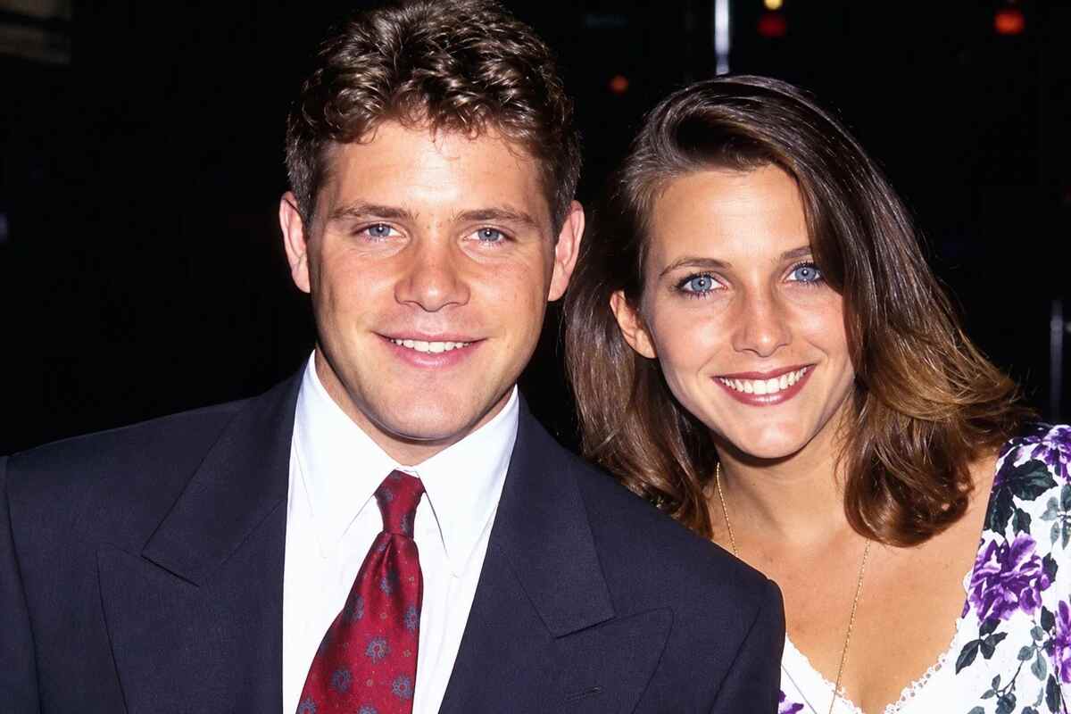 Christine Harrell and Sean Astin posing together at a formal event.